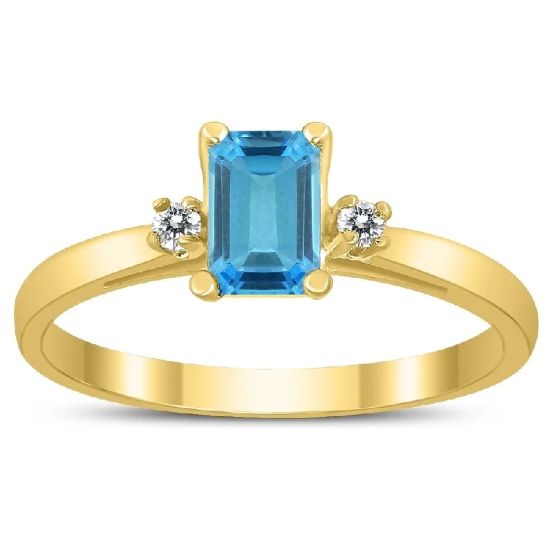 Emerald Cut 6X4MM Blue Topaz and Diamond Three Stone Ring in 10K Yellow Gold