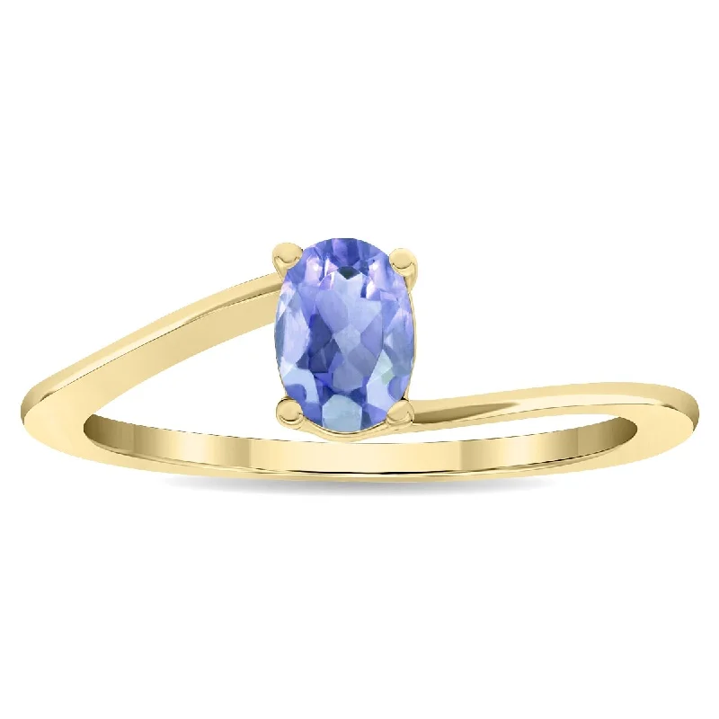 Women's Solitaire Oval Shaped Tanzanite Wave Ring in 10K Yellow Gold